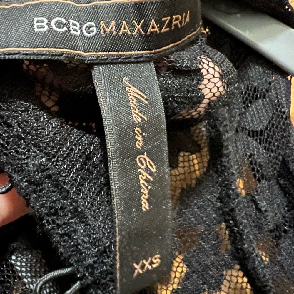 A Black lace blouse still look new, BCBGMaxazria brand.